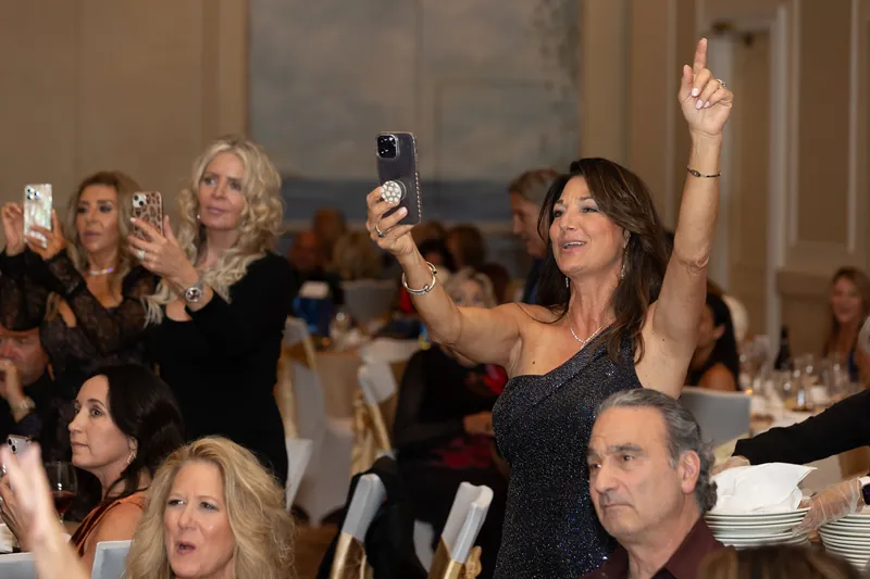 Revel performing a live painting at a gala fundraiser
